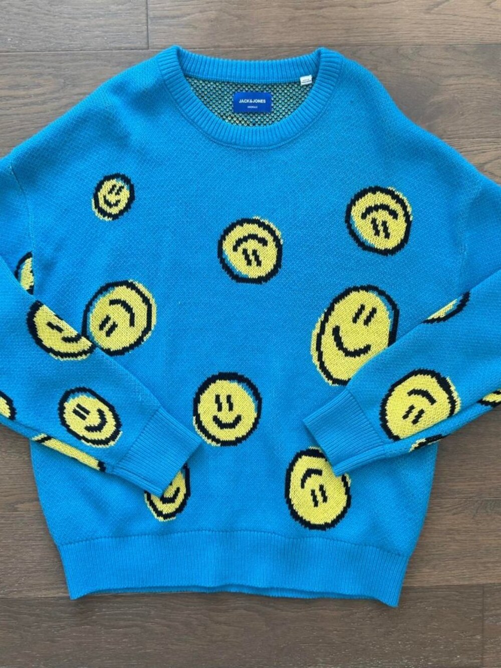 Blue knit smiley face sweater